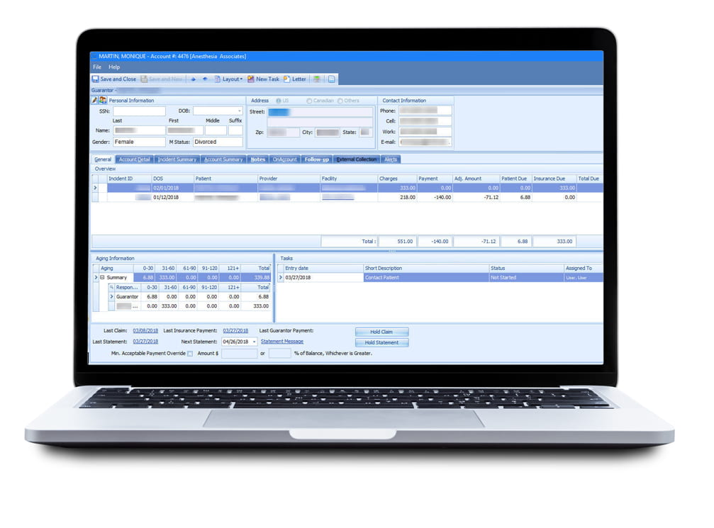 medical practice management software on laptop screen