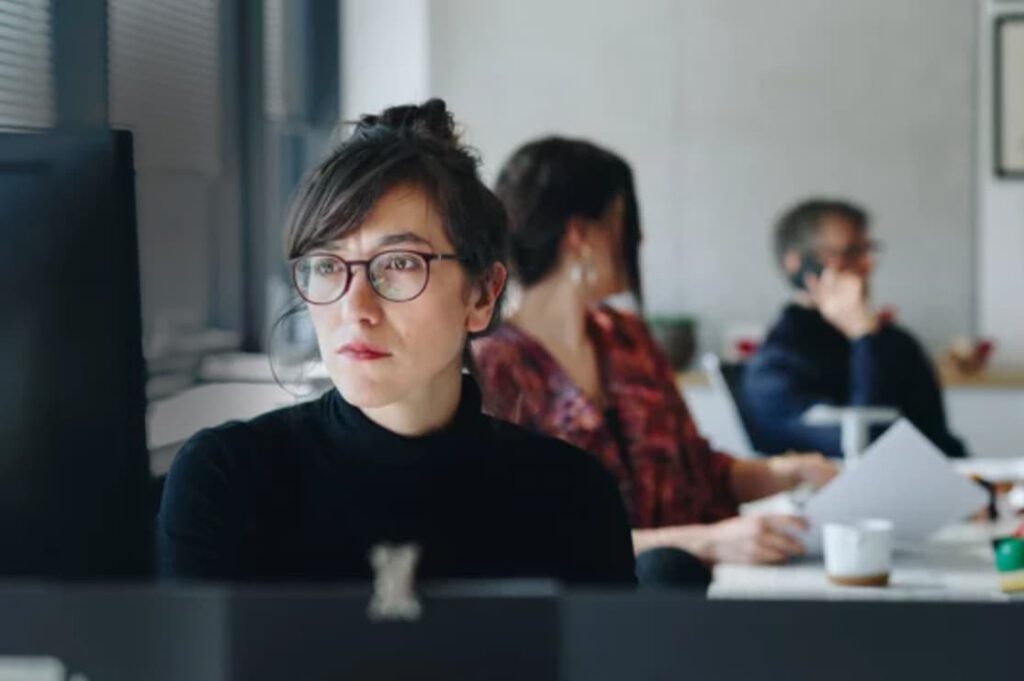 healthcare billing call center worker asian looking at screen